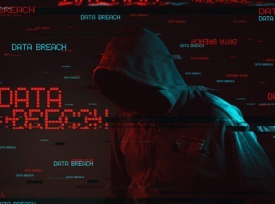 Hooded figure in red digital noise with the words 'Data Breach' repeating across the image, symbolizing a hacker attack and the threat of compromised data security.