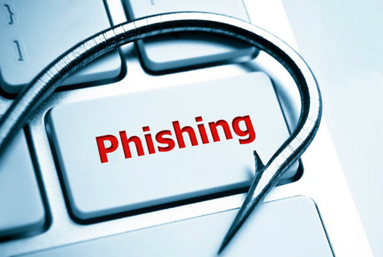 Close-up of a fishing hook symbolizing phishing threats, intertwined with computer keyboard keys, with the red word 'Phishing' prominently displayed.