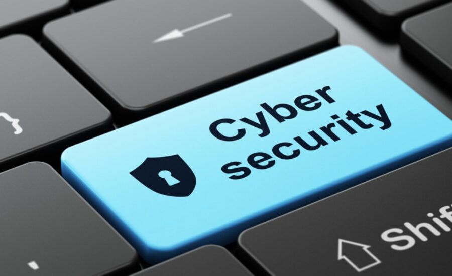 Macro shot of a computer keyboard with a blue key highlighting 'Cyber Security' and a shield icon, emphasizing the importance of cybersecurity in technology and online safety.